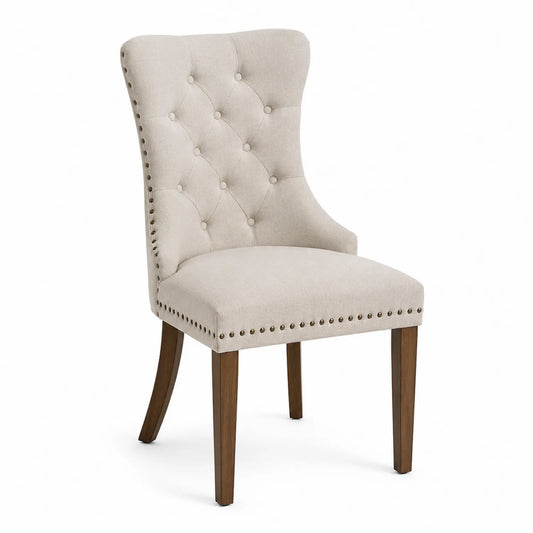 Silla de lino beige con patas de madera y respaldo capiton¨¦